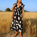 Amina™ Jurk – Zomerse Vrijheid met Grafische Print